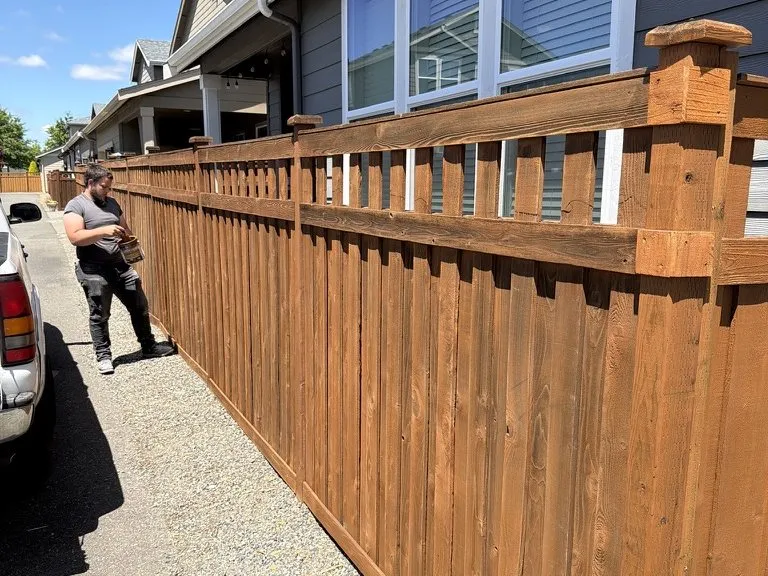 A new cedar fence with capped posts