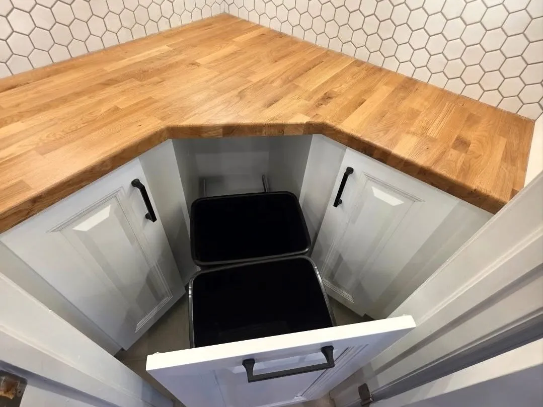 A butcher-block corner counter in a finished pantry