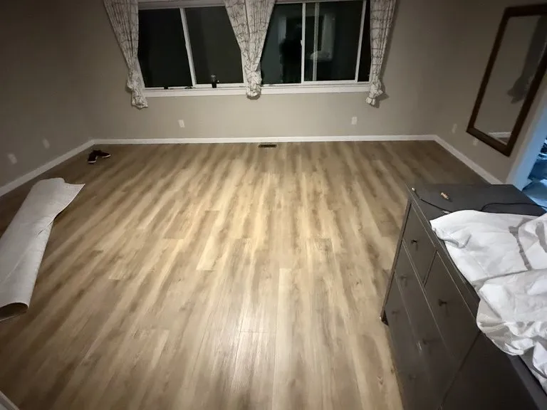 New plank flooring run through a finished living room