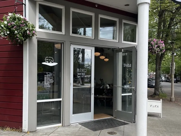 The finished entrance to the storefront, with new glass doors