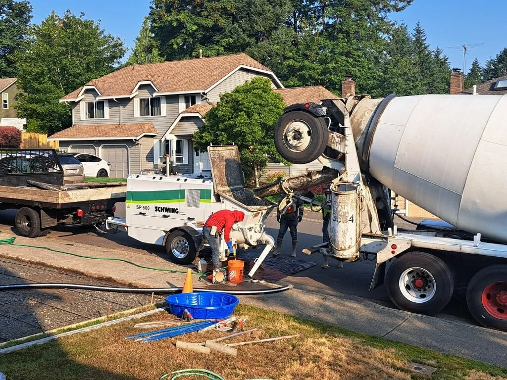 A concrete truck on site during a patio pour