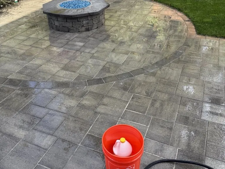 A paver patio with a built-in fire pit