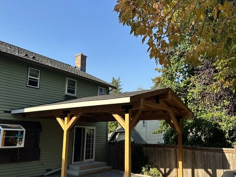 A finished covered patio on timber posts over a concrete slab