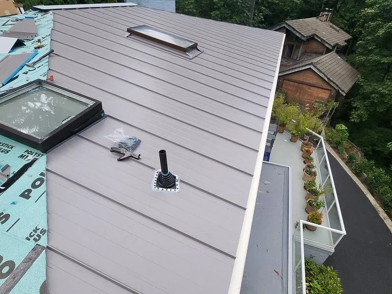 A new standing-seam metal roof with a skylight