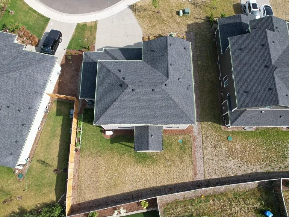 A finished shingle roof and ridge line
