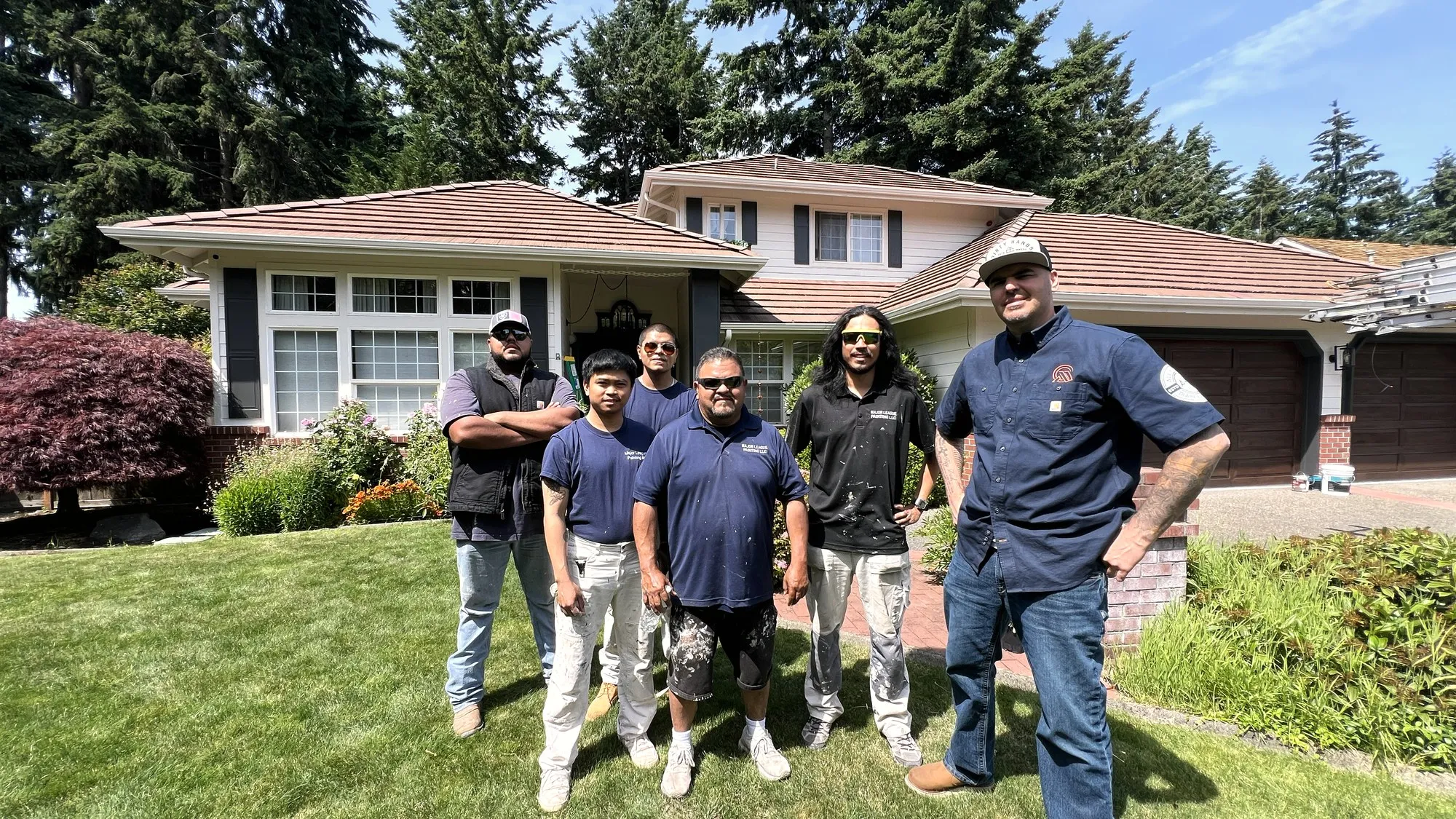 The All Home HX crew standing together outside a home they worked on