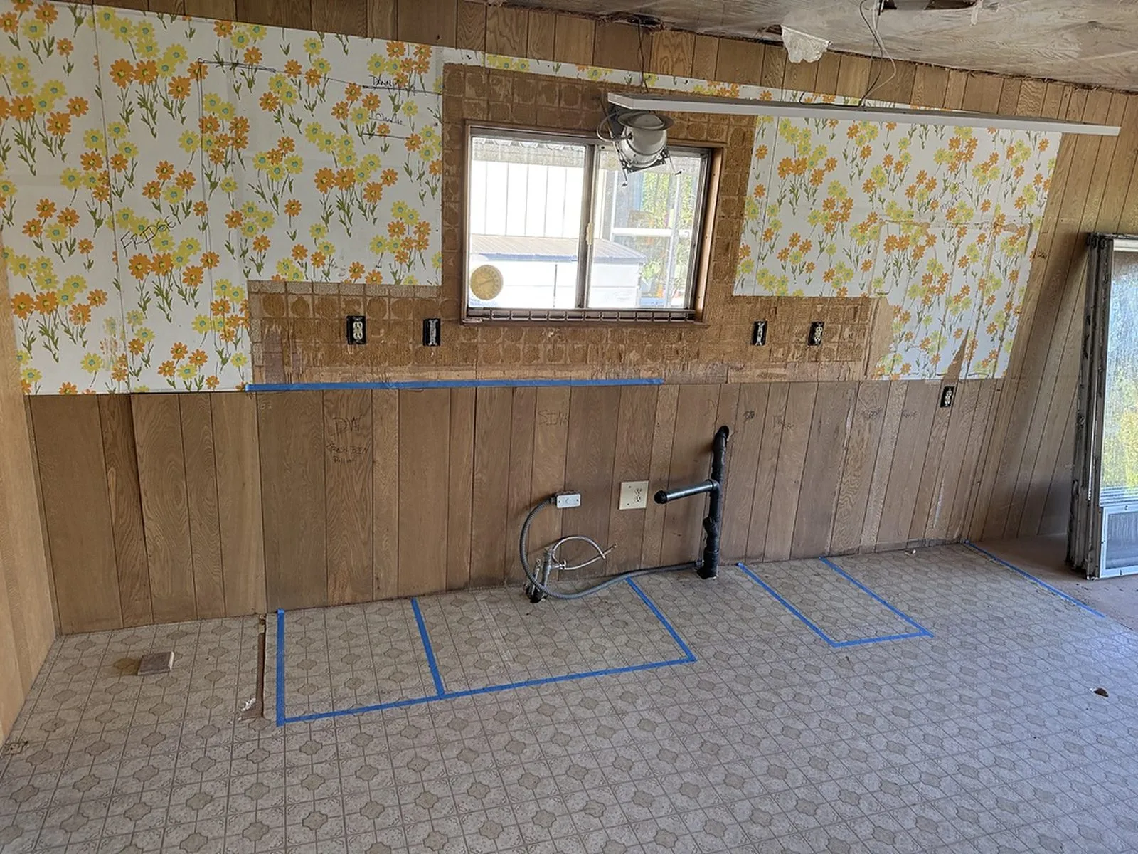 The original kitchen from the opposite corner, showing the wallpaper and panelling